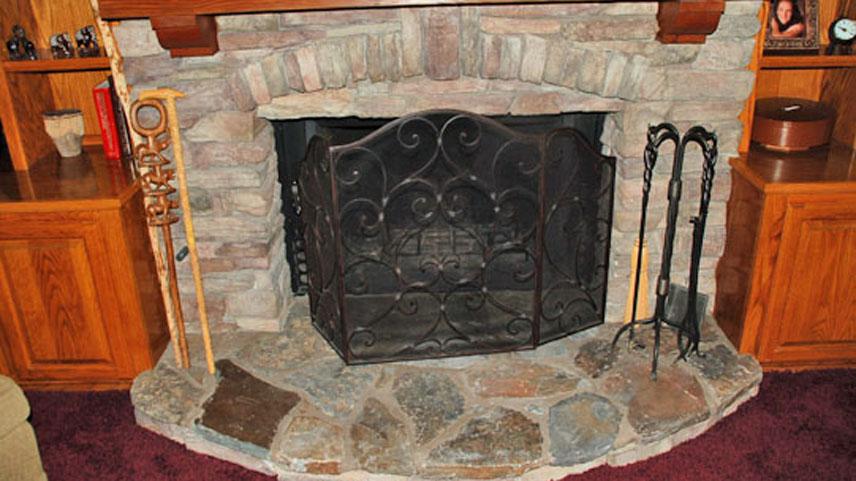 Masonry (Pre cast stone veneer Indoor Fireplace with wood mantle).jpg