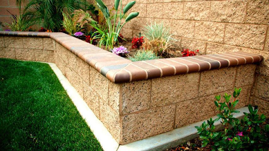 Masonry (Splitface Block wall and raised planter with Bull Nose brick cap).jpg