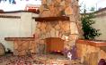 Masonry (Outdoor fireplace with natural stone hearthe and precast dressfield and river rock combo).jpg